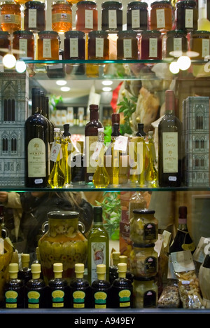Vertical close up of many Tuscan delicacies in various bottles, jars and packets displayed in a shop window Stock Photo