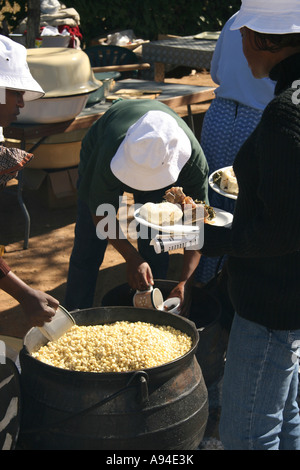 https://l450v.alamy.com/450v/a94e3k/traditionally-prepared-maize-being-served-from-a-three-legged-iron-a94e3k.jpg