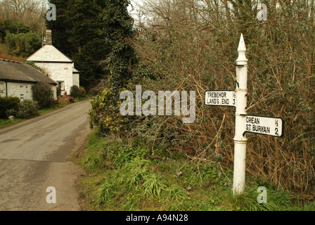 Old white signpost pointing to Lands End, Cornwall, England, UK. Stock Photo