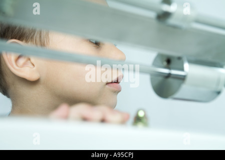 Boy, scale in foreground, close-up Stock Photo