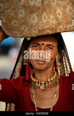 Tribal Indian woman from Kutch district at bus-stand, Bhuj, Gujarat, India Stock Photo