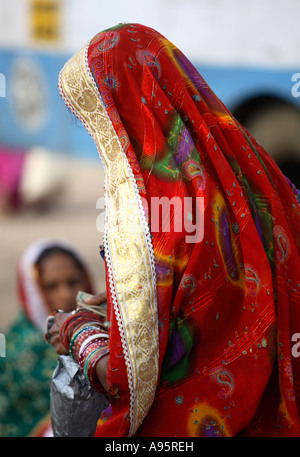 Decorative veil on Tribal Indian woman from Kutch district at bus-stand, Bhuj, Gujarat, India Stock Photo