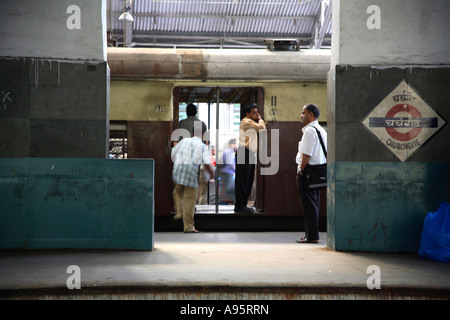 Indian Passengers boarding train at Churchgate Railway Terminus, Mumbai, India Stock Photo