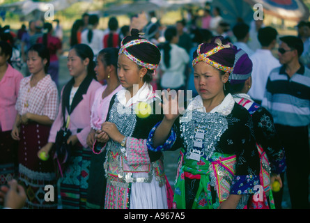 Hmong girls in traditional costume at courting ceremony, Thalat, Lao Stock Photo