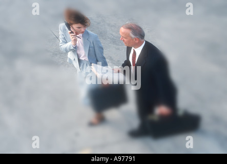 man woman business executives rushing to office Stock Photo