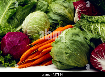 Agriculture - Mixed vegetables on white Iceberg lettuce red and green cabbage carrots Napa cabbage and radicchio, in studio. Stock Photo