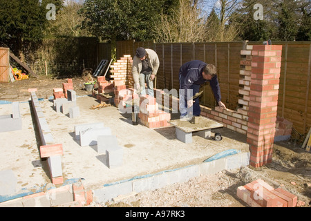 bricklayers constructing a wall for a garage Stock Photo