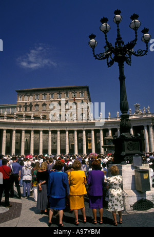 The priest of St. Paul and St. Peter's Church greets neighbours after ...