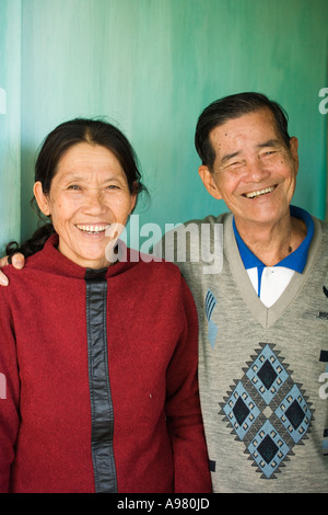 Author, poet, artist, and retired Viet Cong colonel and his wife in their home in Hoi An, Vietnam Stock Photo