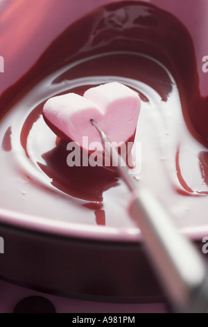 Chocolate fondue with heart shaped marshmallow FoodCollection Stock Photo