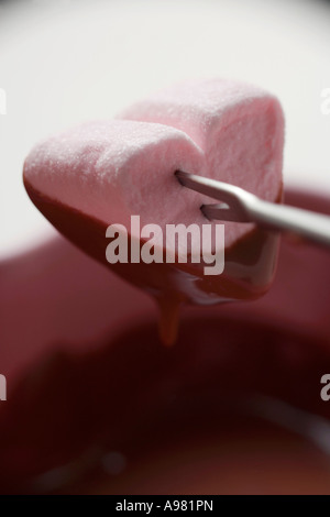 Chocolate fondue with heart shaped marshmallow FoodCollection Stock Photo