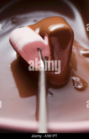 Chocolate fondue with heart shaped marshmallow FoodCollection Stock Photo