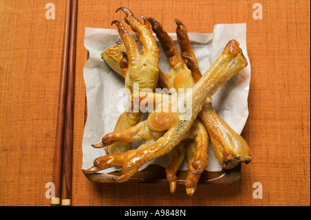 Deep fried chicken feet on paper Asia FoodCollection Stock Photo