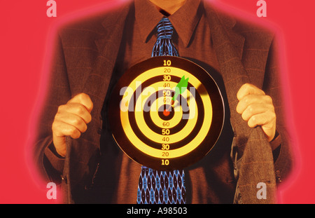 Businessman with dartboard on his chest Stock Photo