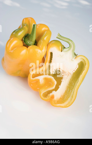 Yellow peppers whole and halved FoodCollection Stock Photo