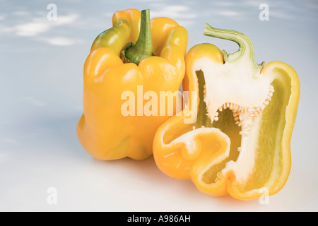 Yellow peppers whole and halved FoodCollection Stock Photo