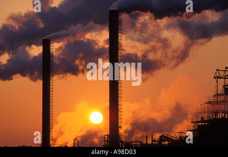 Belching Smokestacks Pollution at Sunset Avonmouth England UK Stock Photo