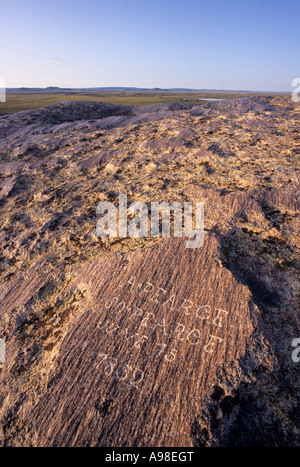 NAMES CARVED ON INDEPENDENCE ROCK ALONG THE OREGON TRAIL. NEAR MUDDY GAP, WYOMING. SUMMER. Stock Photo