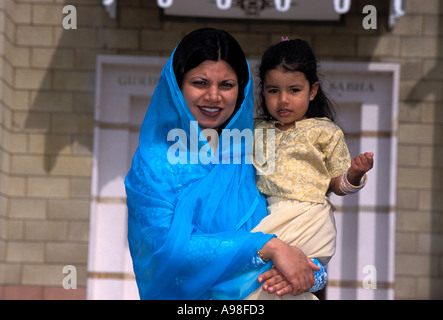 Sikh mother and daughter outside Gurdwara temple London England Stock Photo