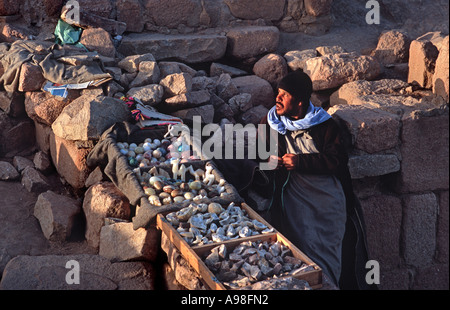 Bedouin vendor selling from his stall on the summit of Mount Sinai 'holy land' Sinai Egypt Stock Photo