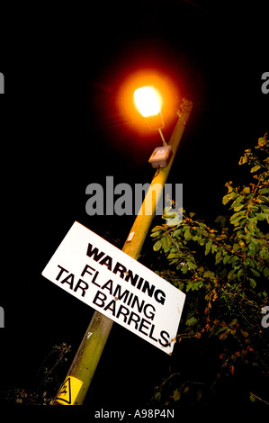 Warning sign for the Rolling of the Tar Barrels festival Ottery St Mary Devon GB Stock Photo