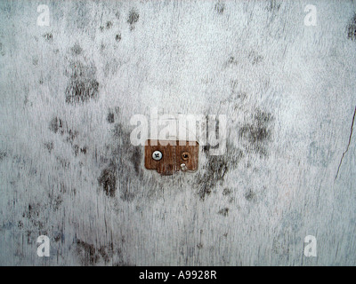 old paint on exterior wall forms an abstract urban texture pattern Stock Photo