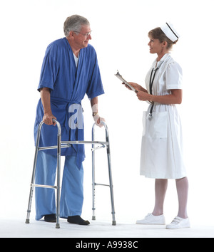 mature man with walker talking to nurse in hospital Stock Photo