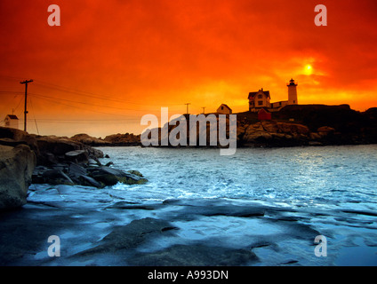 Cape Neddick Lighthouse on Nubble Rock in Maine USA at sunrise showing a storm brewing Stock Photo