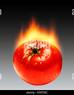 Computer generated image of a tomato with water droplets that appears to be on fire Stock Photo