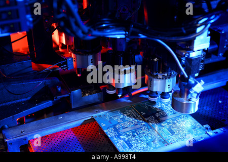 Automated Printed Circuit Board Manufacturing view inside automatic soldering machine Stock Photo