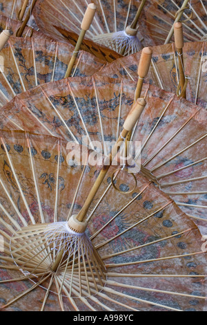 The underside of handmade oiled rice paper umbrellas at the Umbrella Making Centre in Bo Sang Thailand Stock Photo