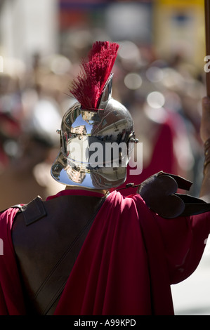 Rear view of man wearing a Roman soldiers uniform and helmet during  Holy Week Passion Play, Balmaseda, northern Spain. Stock Photo