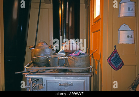 kitchen equipment pots and pans on an old stoven in a kitchen of a ship in Finland Stock Photo