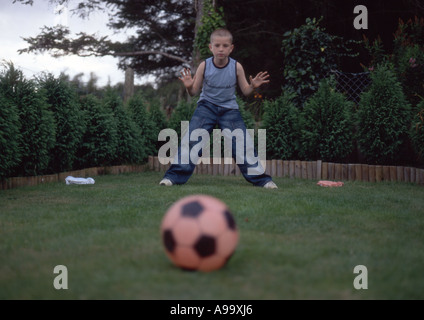 boy as goalkeeper getting ready for penalty kick Stock Photo