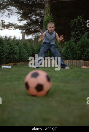 boy as goalkeeper getting ready for penalty kick Stock Photo