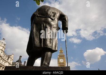 A statue of Sir Winston Churchill in Parliament Square facing the  Houses of Parliament, London, UK Stock Photo
