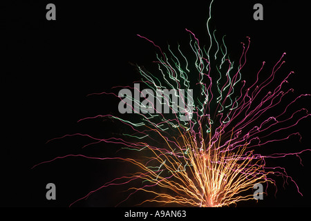Fireworks exploding in black night sky close up Stock Photo