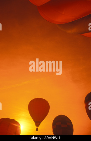GROUP OF AIRBORNE HOT AIR BALLOONS TAKE OFF Stock Photo