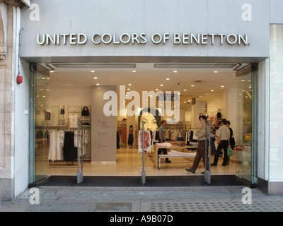 Entrance no doors interior of United Colors of Benetton fashion clothing retail business store from pavement Oxford Circus West End London England UK Stock Photo