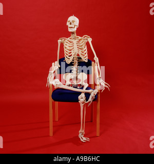 Skeleton relaxing in a chair Stock Photo