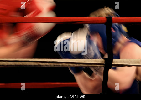 Boxing match with motion blurred boxers Stock Photo