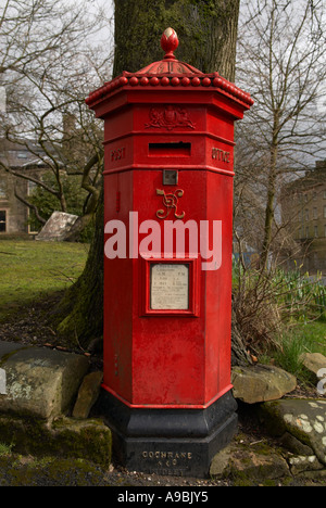 Hexagonal red mail Victorian post box in Buxton Derbyshire 'Great Britain' Stock Photo