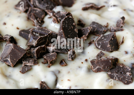 Close up of chocolate chips in dough soon to be cookies or cake Stock Photo