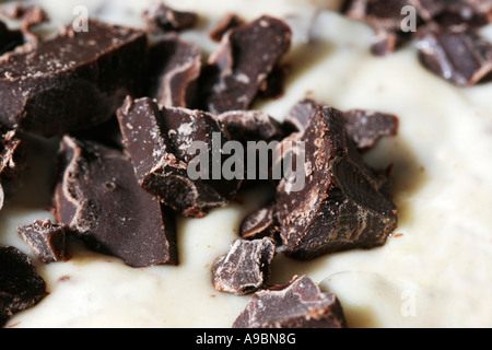 Close up of chocolate chips in dough soon to be cookies or cake Stock Photo