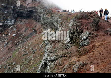 Visitors on edge of crater of Vesuvius near Pompeii Italy Stock Photo