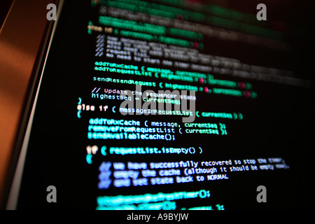 Highly technical looking computer program on screen in darkened room Stock Photo