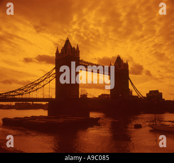 Tower Bridge at sunset in London England on Thames River Stock Photo