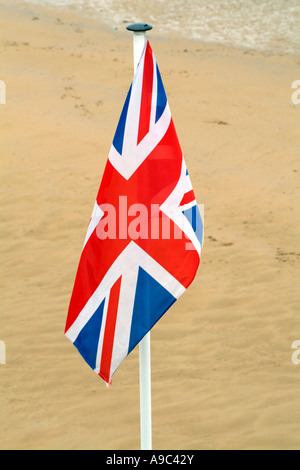 Union Jack British flag flying from flagpole Stock Photo