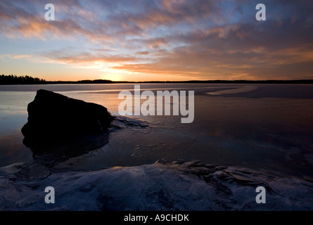 Last rays of sun reflecting from new pristine sea ice skim layer at ...