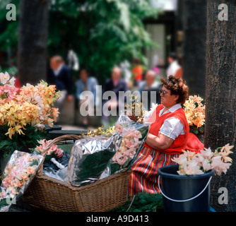 Traditional flower seller outside the Cathedral, Funchal, Madeira, Portugal Stock Photo
